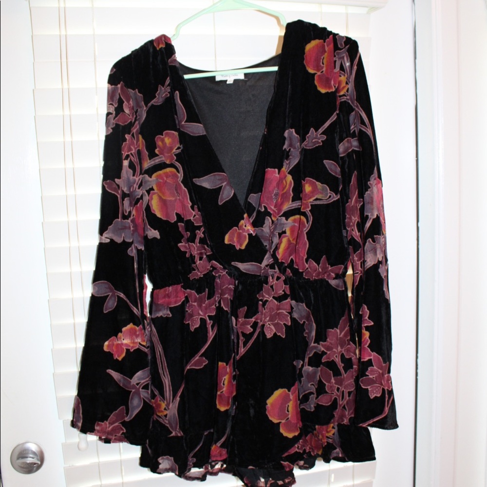 Purple flowered long sleeved romper